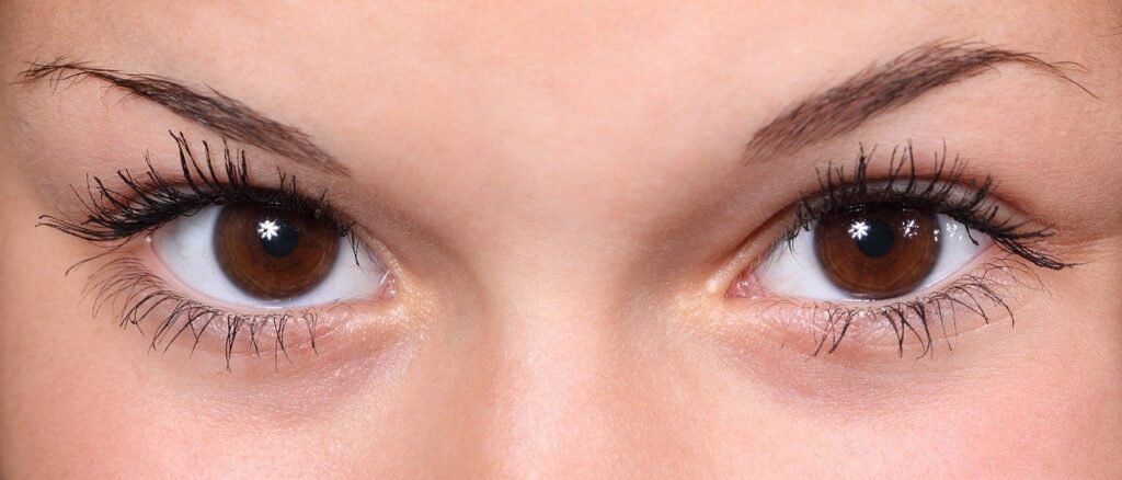 female wide open brown eyes